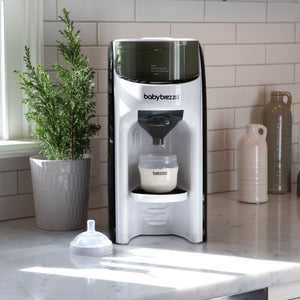 Baby formula maker next to potted plant #variant_white